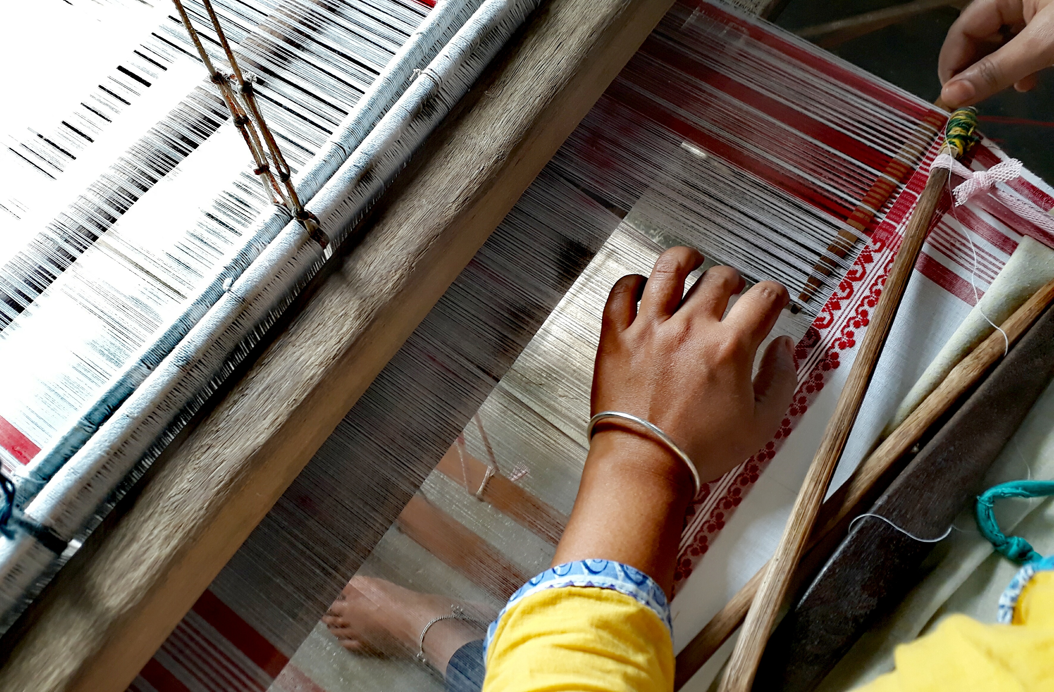 Signifies genuinity of loom origin of products